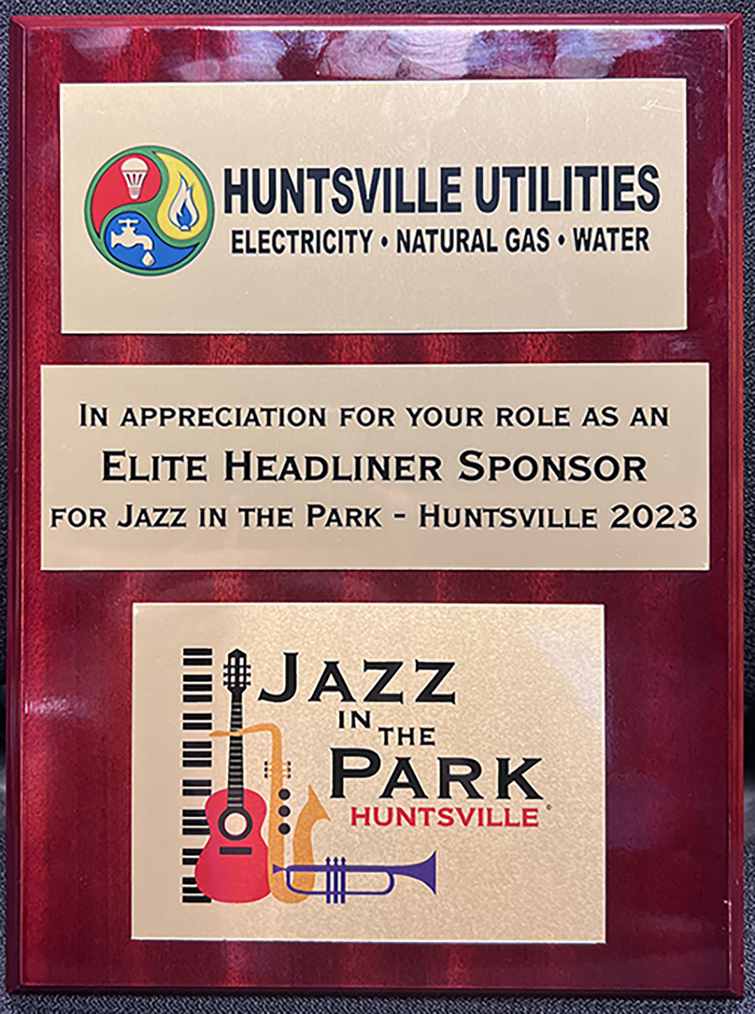 Plaque that reads, "In appreciation for your role as an Elite Headliner Sponsor for Jazz in the Park - Huntsville 2023."